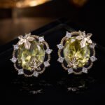 Maple leaf oval cubic zirconia stud earrings with micro-paved scalloped halo border and 925 sterling silver posts