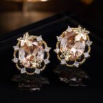 Maple leaf oval cubic zirconia stud earrings with micro-paved scalloped halo border and 925 sterling silver posts