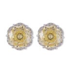 Rose-cut CZ floral stud earrings featuring round rose-faceted center stones framed in micro-pavé CZ scalloped borders, available in soft pink and champagne yellow.