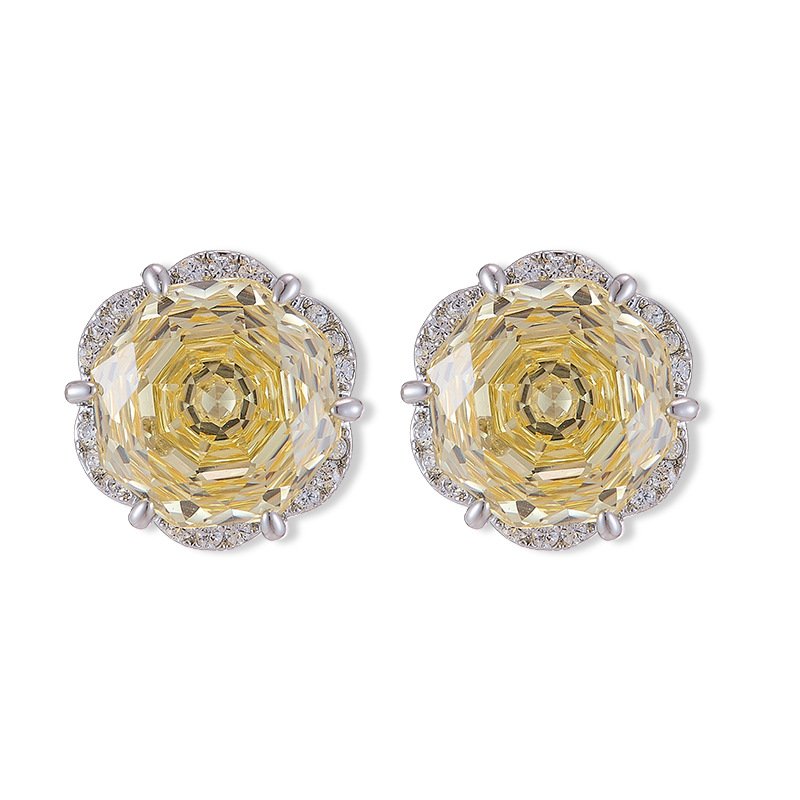 Rose-cut CZ floral stud earrings featuring round rose-faceted center stones framed in micro-pavé CZ scalloped borders, available in soft pink and champagne yellow.