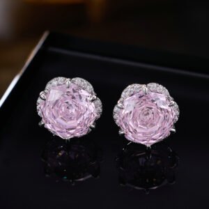Rose-cut CZ floral stud earrings featuring round rose-faceted center stones framed in micro-pavé CZ scalloped borders, available in soft pink and champagne yellow.