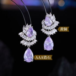 Teardrop CZ crystal drop earrings featuring fan-shaped baguette crystal halos, pear-cut focal stones, and hypoallergenic 925 sterling silver posts.