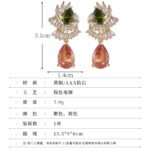 Teardrop CZ crystal drop earrings featuring fan-shaped baguette crystal halos, pear-cut focal stones, and hypoallergenic 925 sterling silver posts.