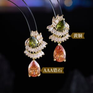 Teardrop CZ crystal drop earrings featuring fan-shaped baguette crystal halos, pear-cut focal stones, and hypoallergenic 925 sterling silver posts.