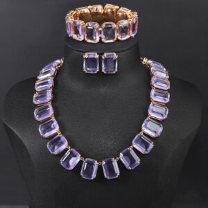 Crystal statement jewelry set wholesale including emerald-cut crystal collar necklace, matching stud earrings, and link bracelet in 18K gold and palladium plated copper.