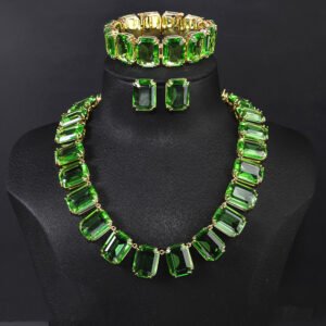Crystal statement jewelry set wholesale including emerald-cut crystal collar necklace, matching stud earrings, and link bracelet in 18K gold and palladium plated copper.