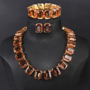 Crystal statement jewelry set wholesale including emerald-cut crystal collar necklace, matching stud earrings, and link bracelet in 18K gold and palladium plated copper.