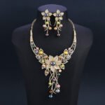 Wholesale Floral Pearl Set featuring colorful shell pearls and CZ flower tassels on gold plated copper from JuneJewelry.com
