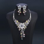 Wholesale Floral Pearl Set featuring colorful shell pearls and CZ flower tassels on gold plated copper from JuneJewelry.com.