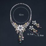 Wholesale Floral Pearl Set featuring colorful shell pearls and CZ flower tassels on gold plated copper from JuneJewelry.com.