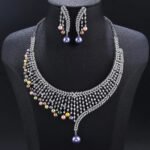 Wholesale Mesh Pearl Set featuring a CZ golden lattice collar with multicolored shell pearl drops on gold plated copper from JuneJewelry.com