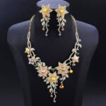 Wholesale Lily Pearl Set featuring CZ lily flowers and vine branch drops with multicolored shell pearls on gold plated copper from JuneJewelry.com – SKU CN11471.909.A.