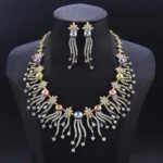 Wholesale Starburst Pearl Set featuring CZ starburst flowers and tassel strands with multicolored shell pearls on gold plated copper from JuneJewelry.com