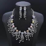 Wholesale Starburst Pearl Set featuring CZ starburst flowers and tassel strands with multicolored shell pearls on gold plated copper from JuneJewelry.com