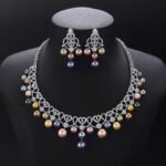 Wholesale Lace Pearl Set featuring CZ paved openwork heart loops with dangling colorful shell pearls on gold plated copper from JuneJewelry.com.
