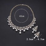 Wholesale Lace Pearl Set featuring CZ paved openwork heart loops with dangling colorful shell pearls on gold plated copper from JuneJewelry.com.