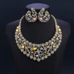 Wholesale Spiral Pearl Set featuring a CZ spiral vine collar with multicolored shell pearls on gold plated copper from JuneJewelry.com.