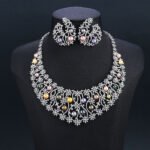 Wholesale Spiral Pearl Set featuring a CZ spiral vine collar with multicolored shell pearls on gold plated copper from JuneJewelry.com.