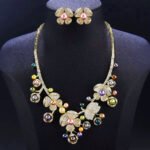 Wholesale Blossom Pearl Set featuring CZ paved flower motifs and dangling colorful shell pearls on gold plated copper from JuneJewelry.com.