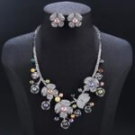 Wholesale Blossom Pearl Set featuring CZ paved flower motifs and dangling colorful shell pearls on gold plated copper from JuneJewelry.com.