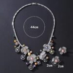 Wholesale Blossom Pearl Set featuring CZ paved flower motifs and dangling colorful shell pearls on gold plated copper from JuneJewelry.com.