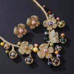 Wholesale Blossom Pearl Set featuring CZ paved flower motifs and dangling colorful shell pearls on gold plated copper from JuneJewelry.com.