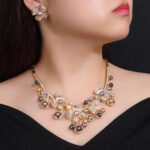 Wholesale Blossom Pearl Set featuring CZ paved flower motifs and dangling colorful shell pearls on gold plated copper from JuneJewelry.com.