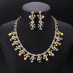 Wholesale Vine Pearl Set featuring CZ micro paved olive leaf branches with dangling colorful shell pearls on gold plated copper from JuneJewelry.com.