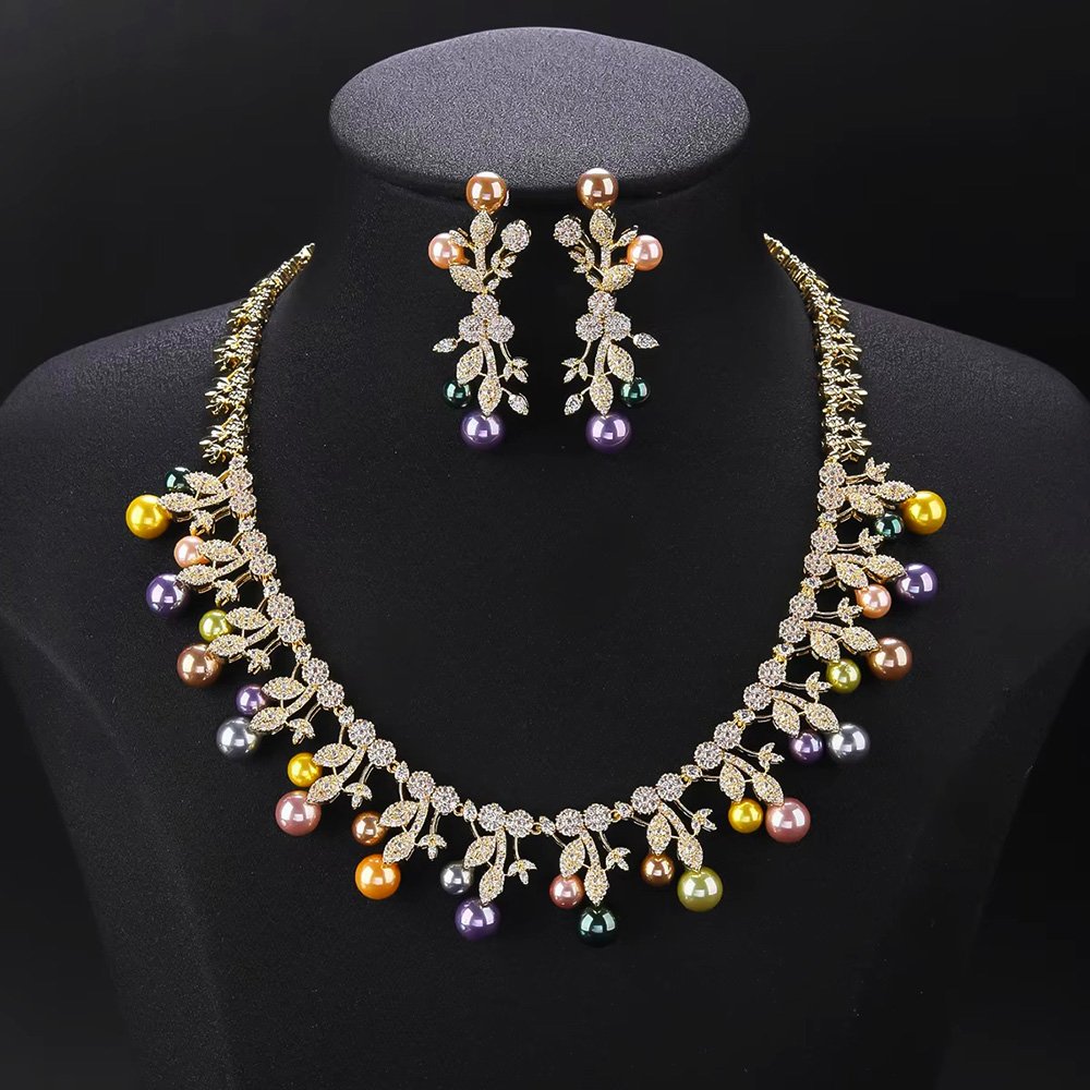 Wholesale Vine Pearl Set featuring CZ micro paved olive leaf branches with dangling colorful shell pearls on gold plated copper from JuneJewelry.com.