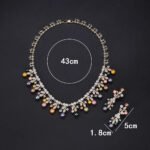 Wholesale Vine Pearl Set featuring CZ micro paved olive leaf branches with dangling colorful shell pearls on gold plated copper from JuneJewelry.com.