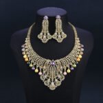 Wholesale Feather Pearl Set featuring a CZ leaf bib necklace with dangling colorful shell pearls on gold plated copper from JuneJewelry.com.