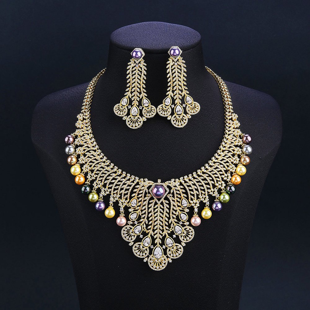 Wholesale Feather Pearl Set featuring a CZ leaf bib necklace with dangling colorful shell pearls on gold plated copper from JuneJewelry.com.