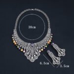 Wholesale Feather Pearl Set featuring a CZ leaf bib necklace with dangling colorful shell pearls on gold plated copper from JuneJewelry.com.