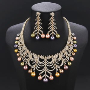 Wholesale Arch Pearl Set featuring a CZ arched leaf bib necklace with dangling colorful shell pearls on gold plated copper from JuneJewelry.com.
