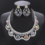 Wholesale Scallop Pearl Set featuring CZ scalloped lace arches with colorful shell pearls on gold plated copper from JuneJewelry.com.