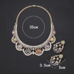 Wholesale Scallop Pearl Set featuring CZ scalloped lace arches with colorful shell pearls on gold plated copper from JuneJewelry.com.