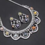 Wholesale Scallop Pearl Set featuring CZ scalloped lace arches with colorful shell pearls on gold plated copper from JuneJewelry.com.