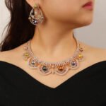 Wholesale Scallop Pearl Set featuring CZ scalloped lace arches with colorful shell pearls on gold plated copper from JuneJewelry.com.