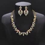 Wholesale Wave Pearl Set featuring CZ wave links with leaf motifs and colorful shell pearls on gold plated copper from JuneJewelry.com.