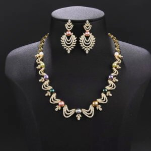 Wholesale Wave Pearl Set featuring CZ wave links with leaf motifs and colorful shell pearls on gold plated copper from JuneJewelry.com.