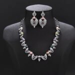 Wholesale Wave Pearl Set featuring CZ wave links with leaf motifs and colorful shell pearls on gold plated copper from JuneJewelry.com.