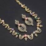 Wholesale Wave Pearl Set featuring CZ wave links with leaf motifs and colorful shell pearls on gold plated copper from JuneJewelry.com.