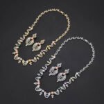 Wholesale Wave Pearl Set featuring CZ wave links with leaf motifs and colorful shell pearls on gold plated copper from JuneJewelry.com.