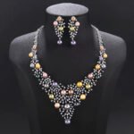 Wholesale Lattice Pearl Set featuring a CZ branch grid collar with colorful shell pearls on gold plated copper from JuneJewelry.com.