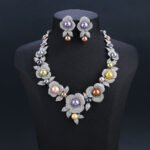 Wholesale Rose Pearl Set featuring CZ paved rose blooms with colorful shell pearls on gold plated copper from JuneJewelry.com.