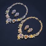 Wholesale Rose Pearl Set featuring CZ paved rose blooms with colorful shell pearls on gold plated copper from JuneJewelry.com.