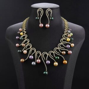 Wholesale Swirl Pearl Set featuring CZ micro paved S-curve links with dangling colorful shell pearls on gold plated copper from JuneJewelry.com.