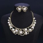 Wholesale Heart Pearl Set featuring CZ paved heart motifs cradling colorful shell pearls on gold plated copper from JuneJewelry.com.