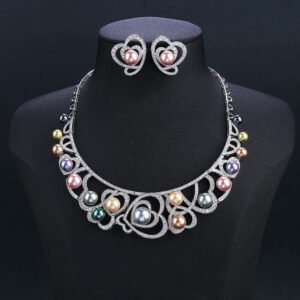Wholesale Heart Pearl Set featuring CZ paved heart motifs cradling colorful shell pearls on gold plated copper from JuneJewelry.com.