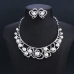 Wholesale Heart Pearl Set featuring CZ paved heart motifs cradling colorful shell pearls on gold plated copper from JuneJewelry.com.